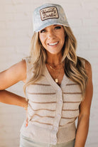 Blonde woman wearing a Howdy Darlin' Embroidery Patch Camo Trucker Hat.