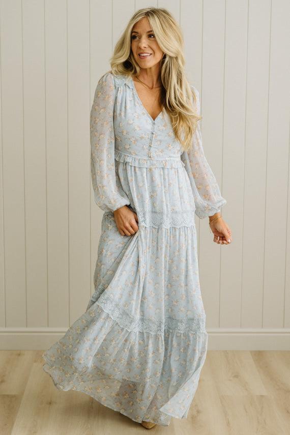 Blonde Woman Wearing a Button Front, Light Blue Floral Lace Paneled Maxi Dress.
