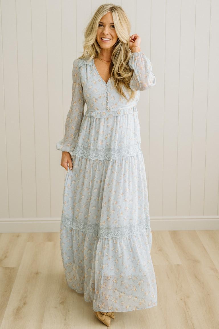 Blonde Woman Wearing a Button Front, Light Blue Floral Lace Paneled Maxi Dress.