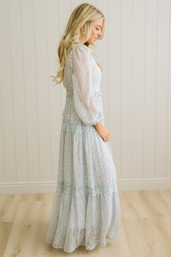 Blonde Woman Wearing a Button Front, Light Blue Floral Lace Paneled Maxi Dress.