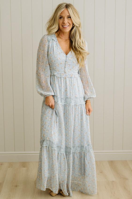 Blonde Woman Wearing a Button Front, Light Blue Floral Lace Paneled Maxi Dress.