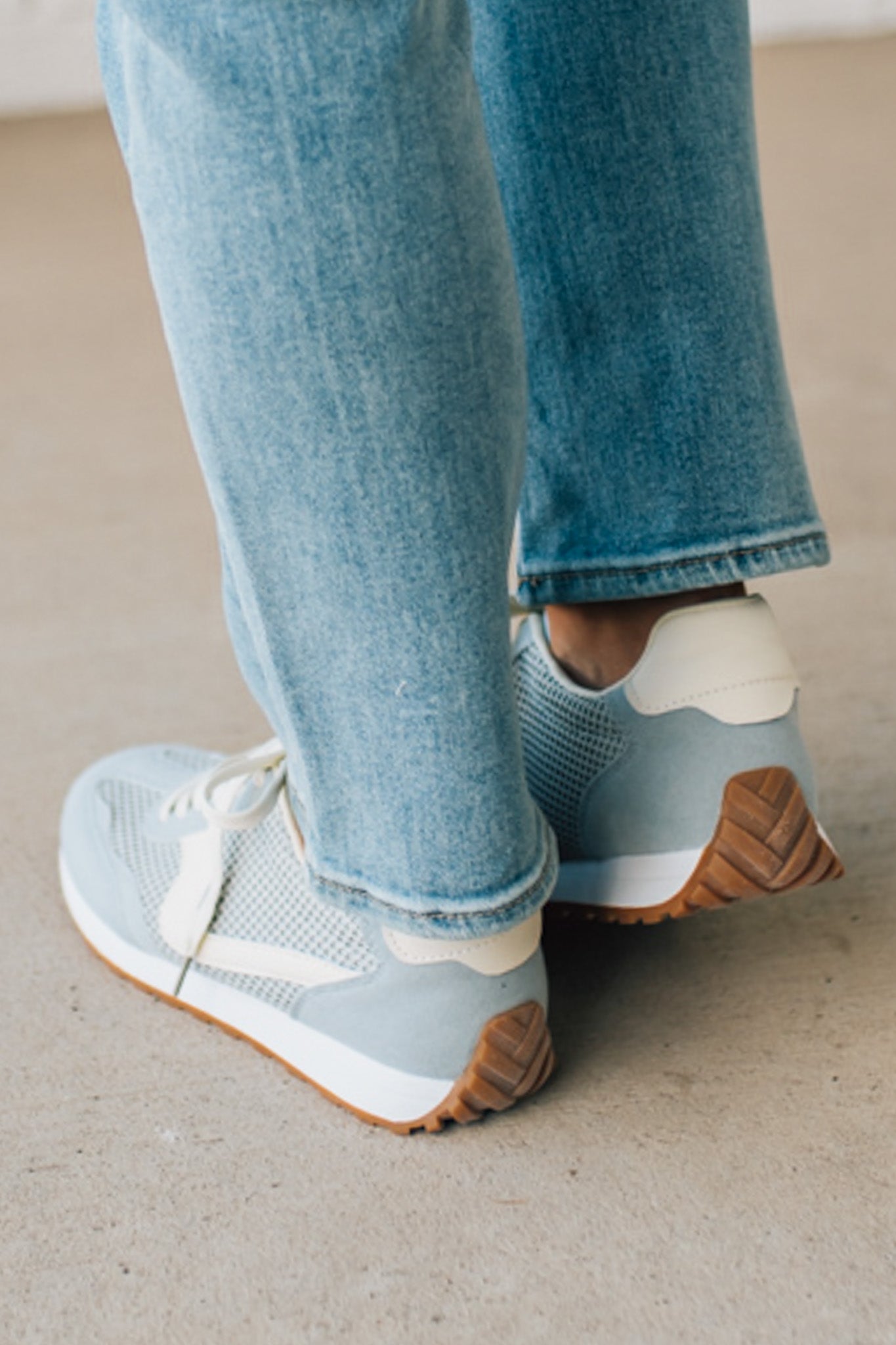 Women's Light Blue Mesh Sneakers with Cream Laces and Accents.