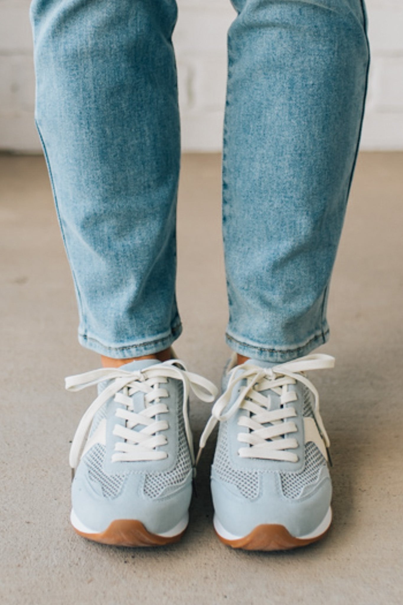 Women's Light Blue Mesh Sneakers with Cream Laces and Accents.