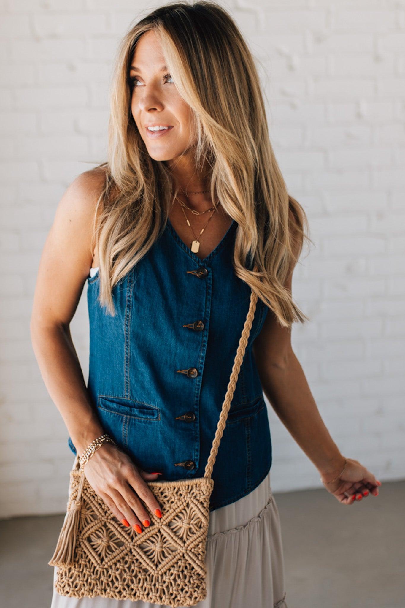 Blonde woman wearing a Macrame Woven Design sling bag with Tassel Zipper Pull.