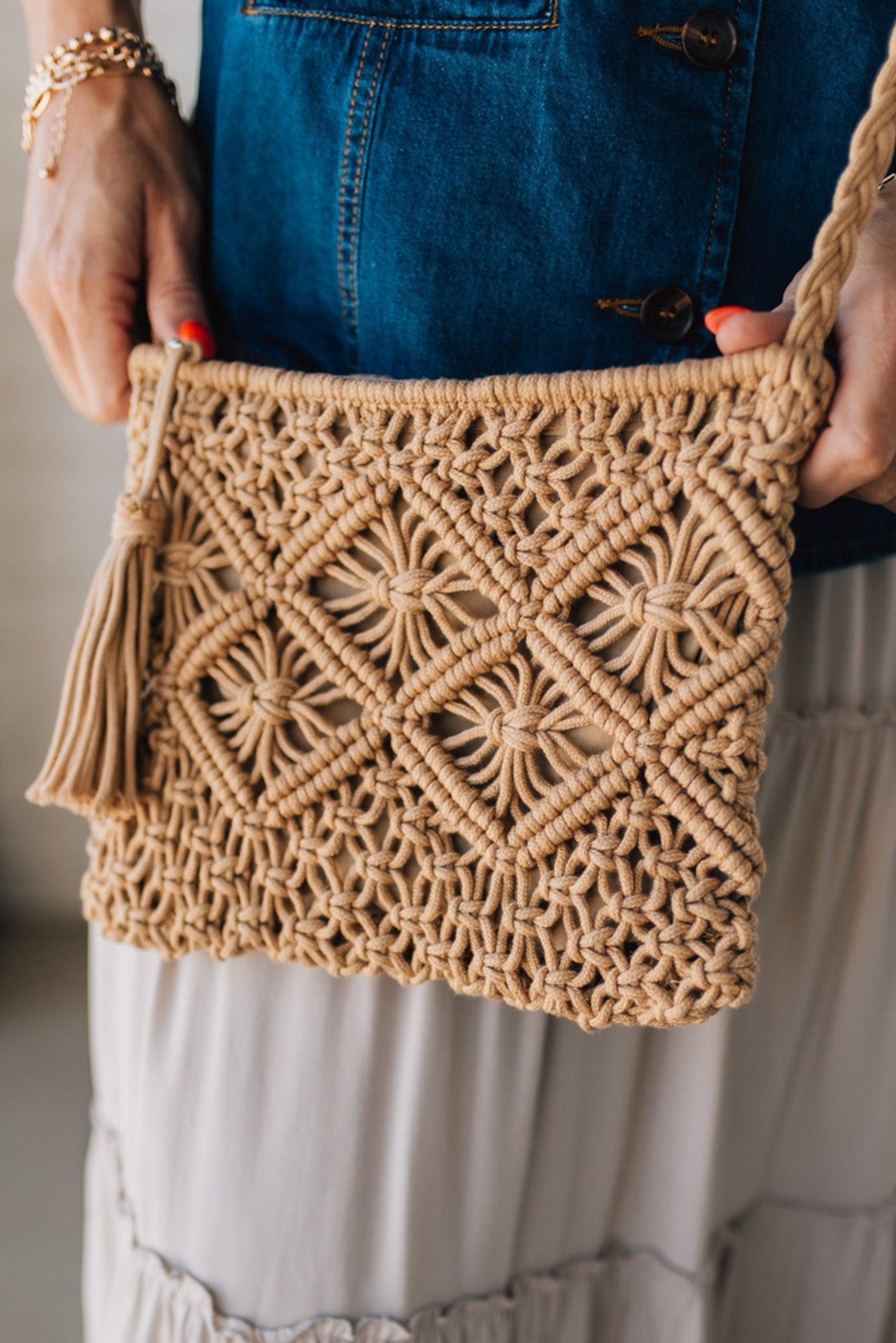 Blonde woman wearing a Macrame Woven Design sling bag with Tassel Zipper Pull.