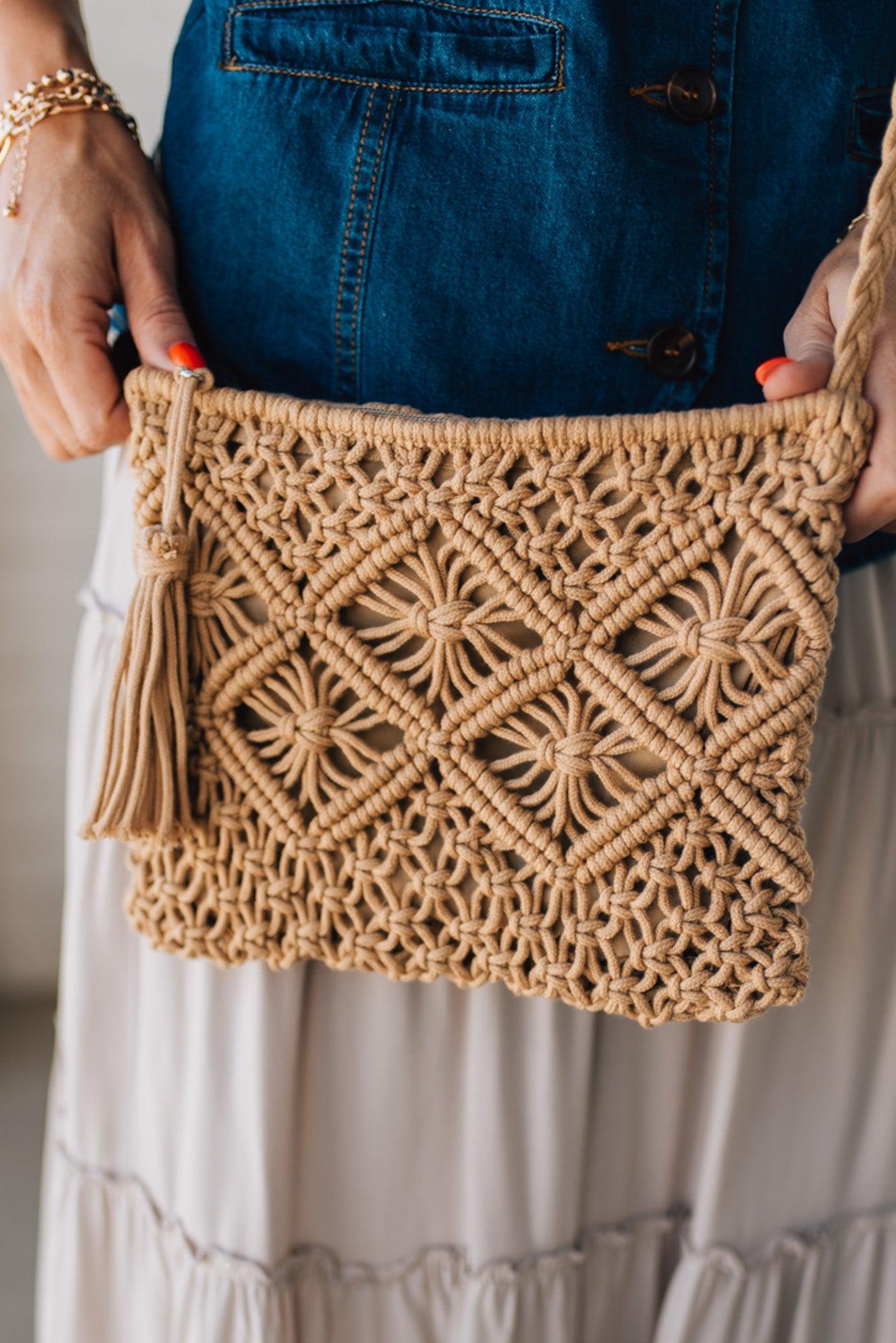 Blonde woman wearing a Macrame Woven Design sling bag with Tassel Zipper Pull.