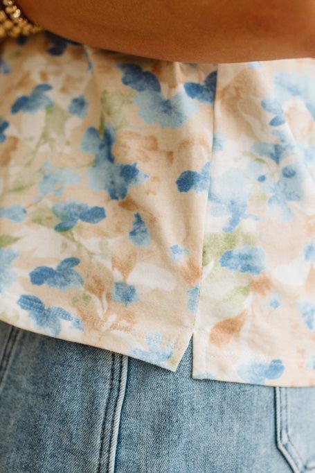 Close-up of floral-patterned fabric on a denim background