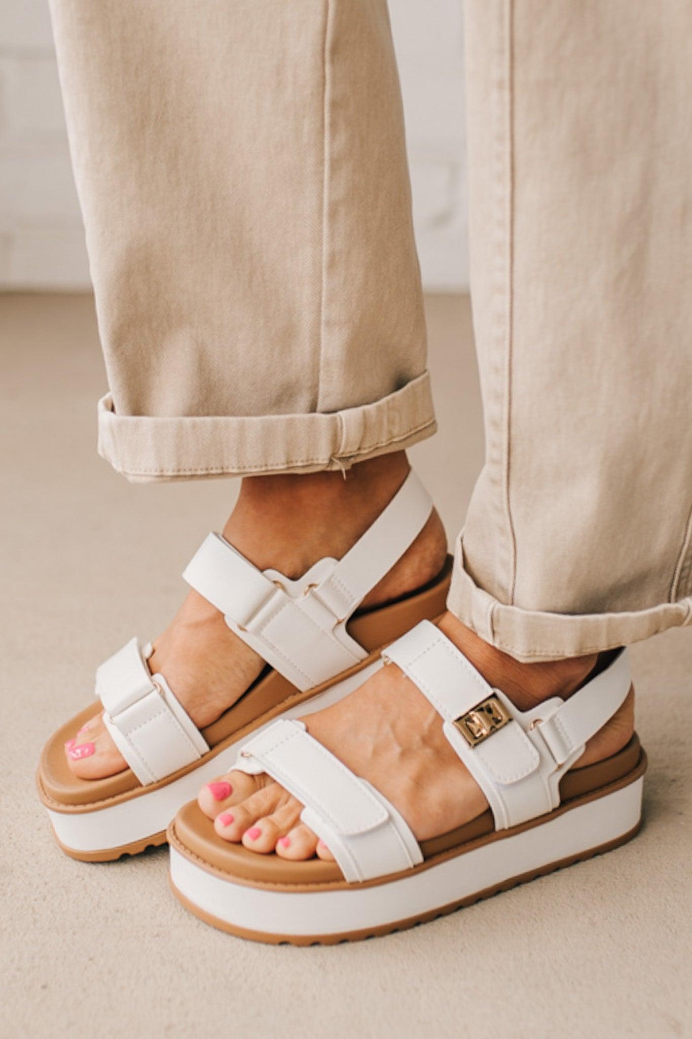 WHITE VELCRO STRAP CHUNKY SANDALS WITH SLINGBACK AND GOLD ACCENTS.