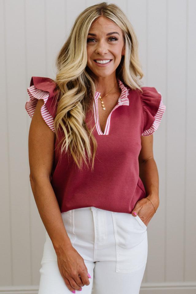 Blonde woman wearing a Striped accent Frill Split Neck Scuba Top