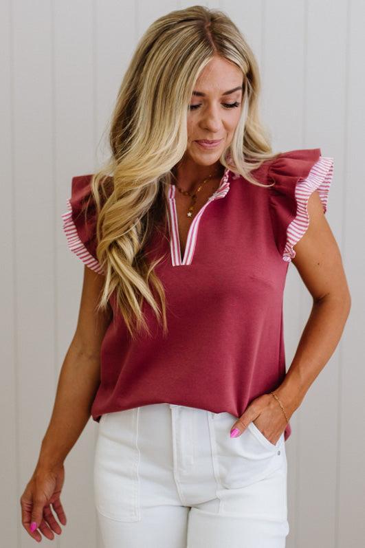 Blonde woman wearing a Striped accent Frill Split Neck Scuba Top