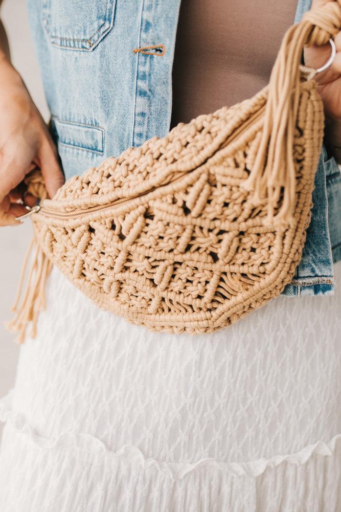 Blonde woman wearing a Woven Macrame Design crossbody bag.