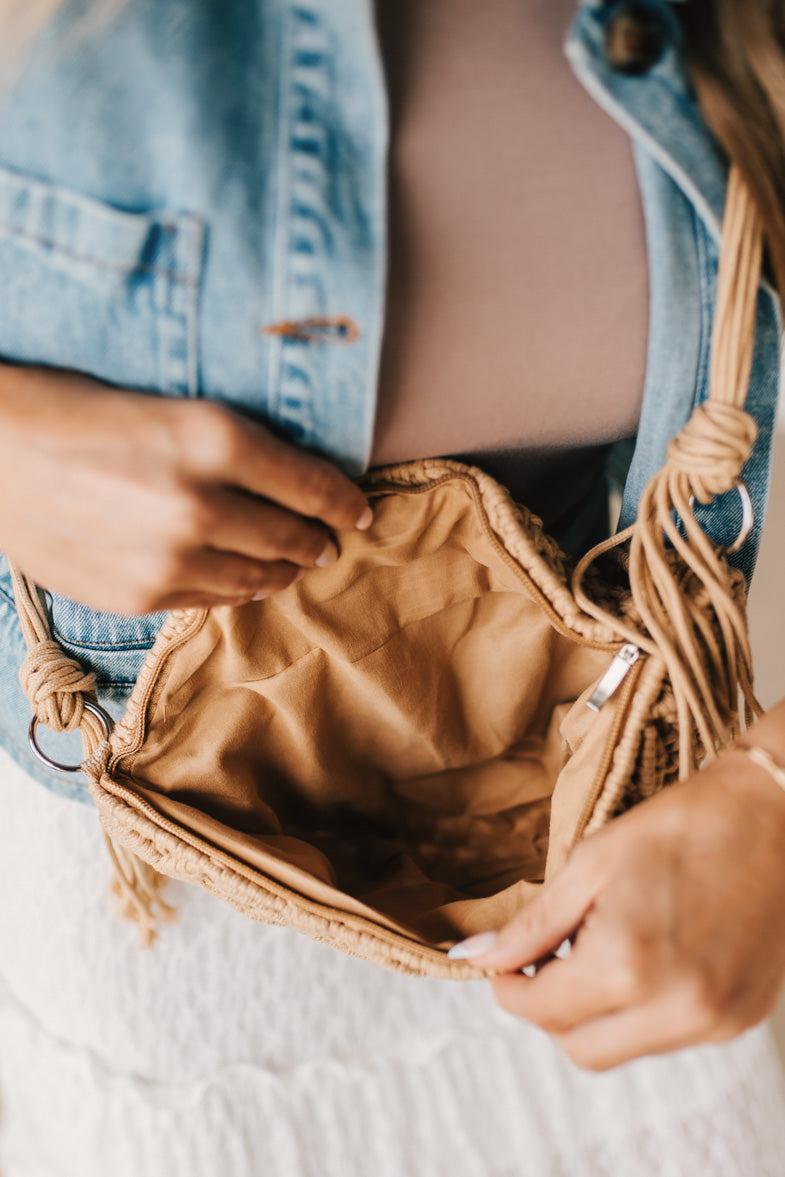 Blonde woman wearing a Woven Macrame Design crossbody bag.