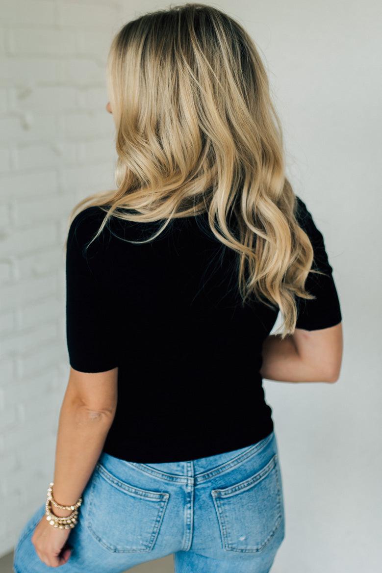 Blonde woman wearing half sleeve lightweight viscose sweater tee.