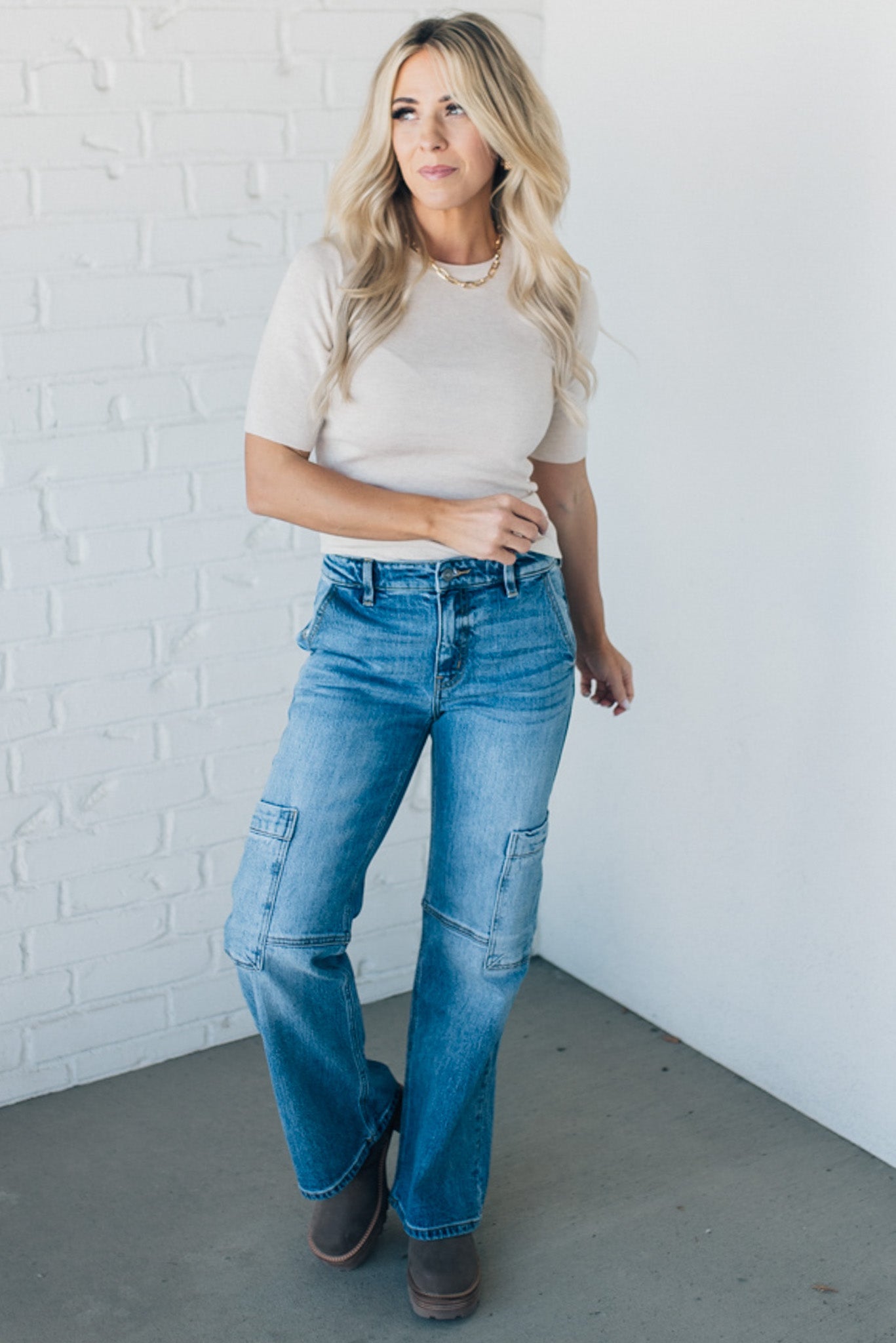 Blonde woman wearing half sleeve lightweight viscose sweater tee.