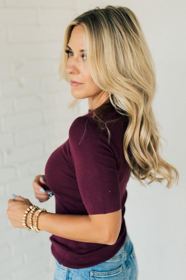 Blonde woman wearing half sleeve lightweight viscose sweater tee.