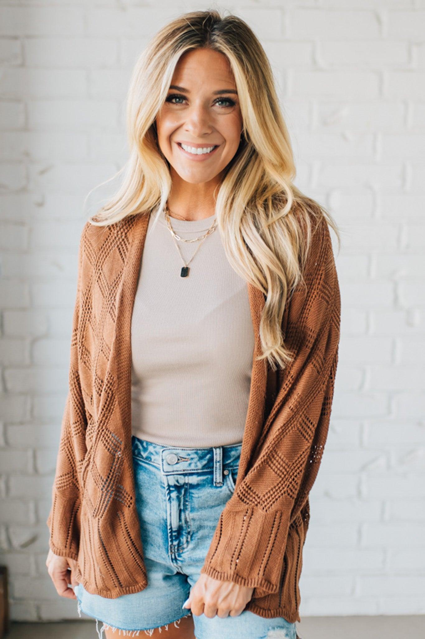 Blonde Model Wearing A Lightweight Crochet Cardigan With Scallop Hem.