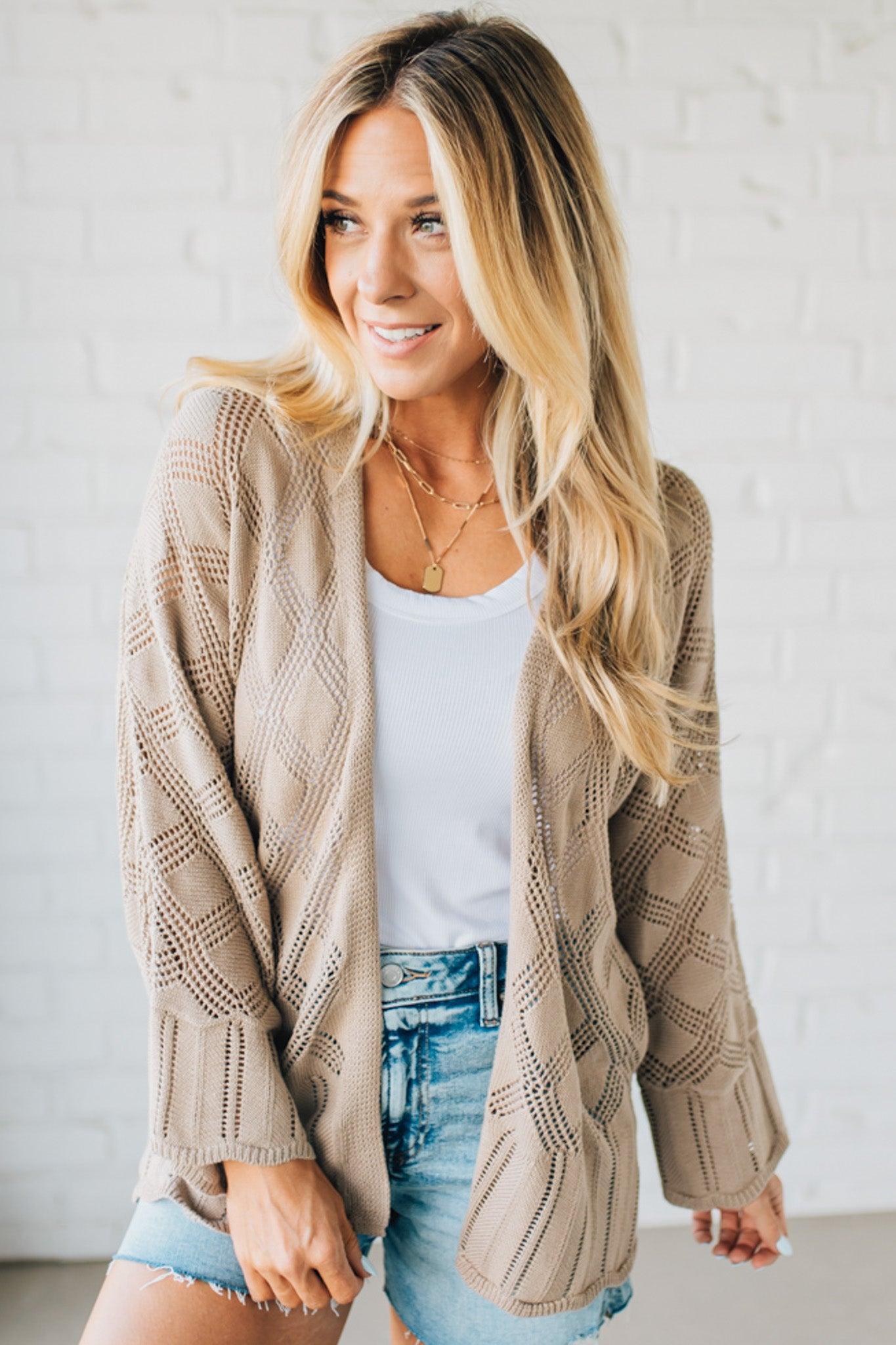 Blonde Model Wearing A Lightweight Crochet Cardigan With Scallop Hem.