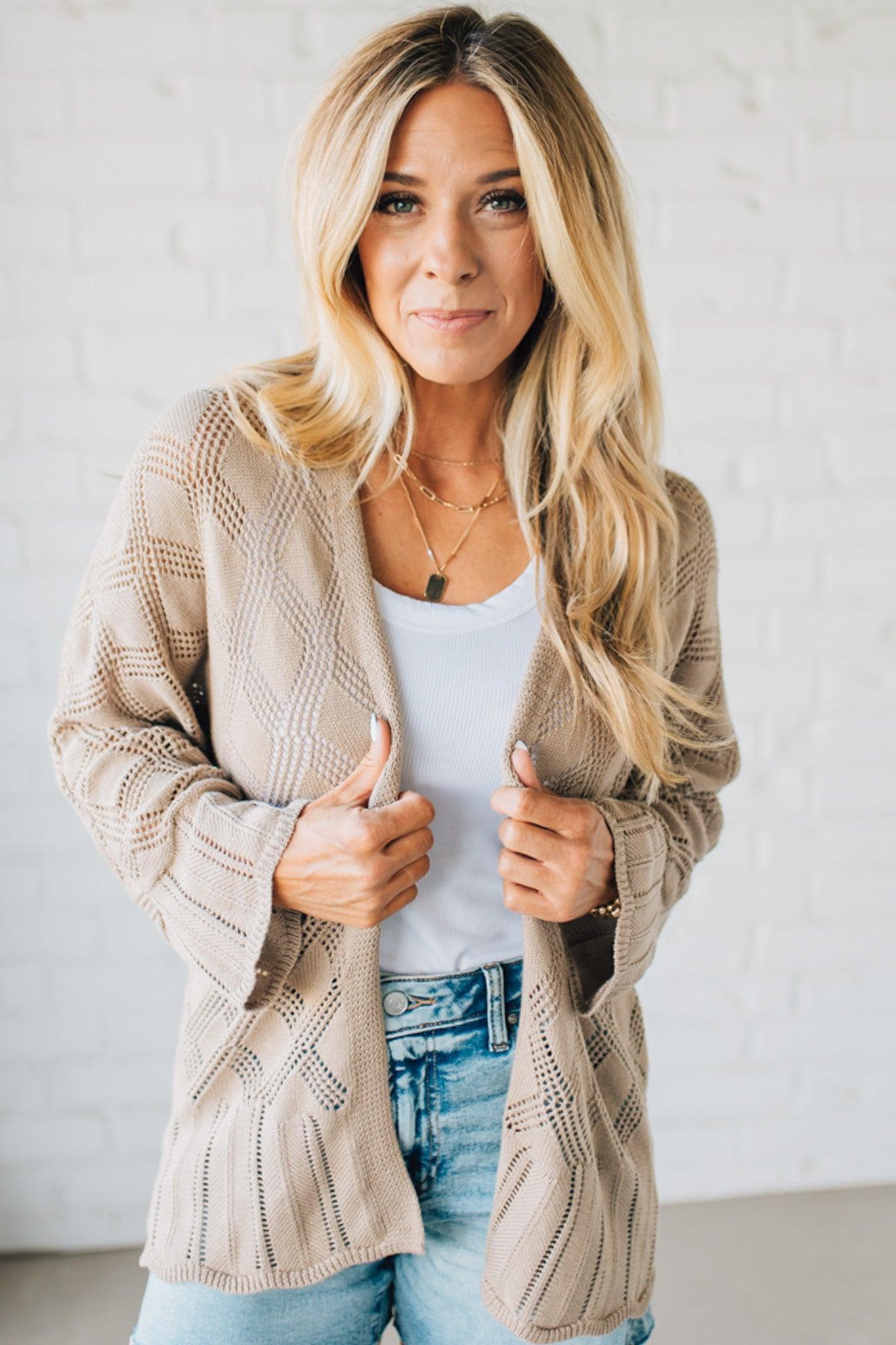 Blonde Model Wearing A Lightweight Crochet Cardigan With Scallop Hem.