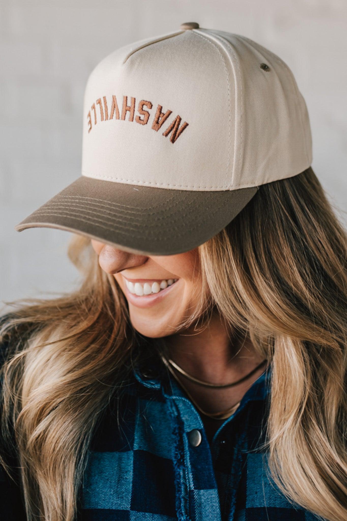 Two tone trucker hat cream and mocha with upside down NASHVILLE embroidery.