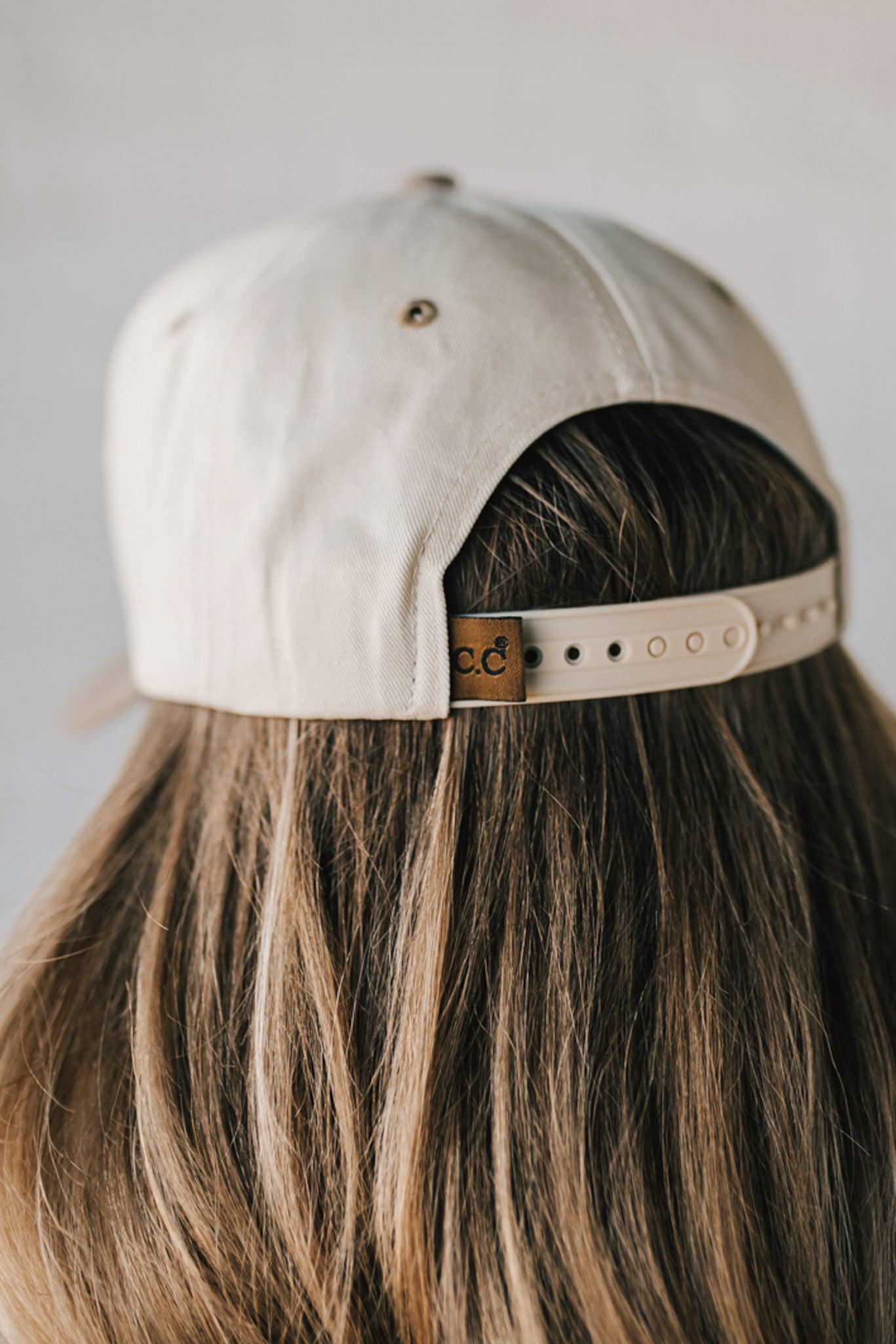Two tone trucker hat cream and mocha with upside down NASHVILLE embroidery.