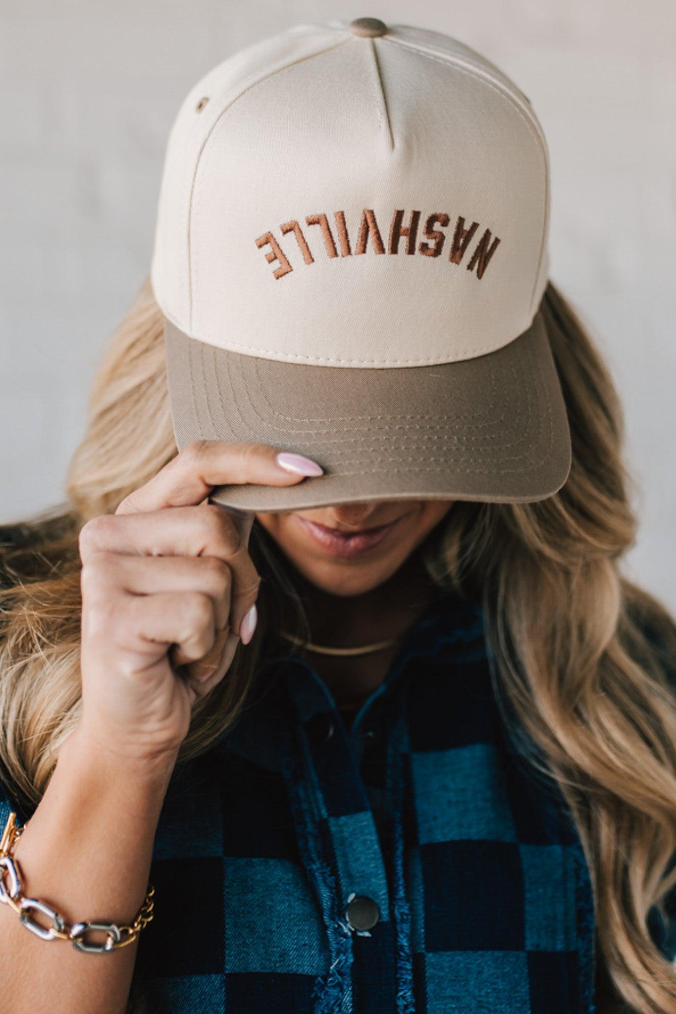 Two tone trucker hat cream and mocha with upside down NASHVILLE embroidery.