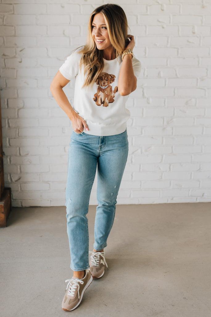 Blonde Woman Wearing a Round Neck Short Sleeve Dog Graphic Sweater.