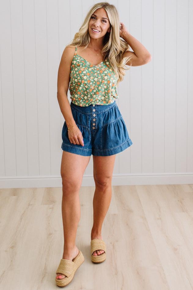 Blonde Woman Wearing a V Neck Floral Printed Tank Top.