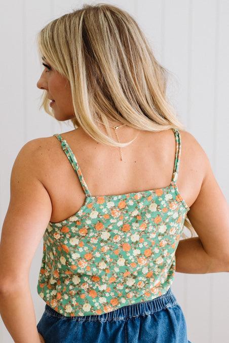 Blonde Woman Wearing a V Neck Floral Printed Tank Top.