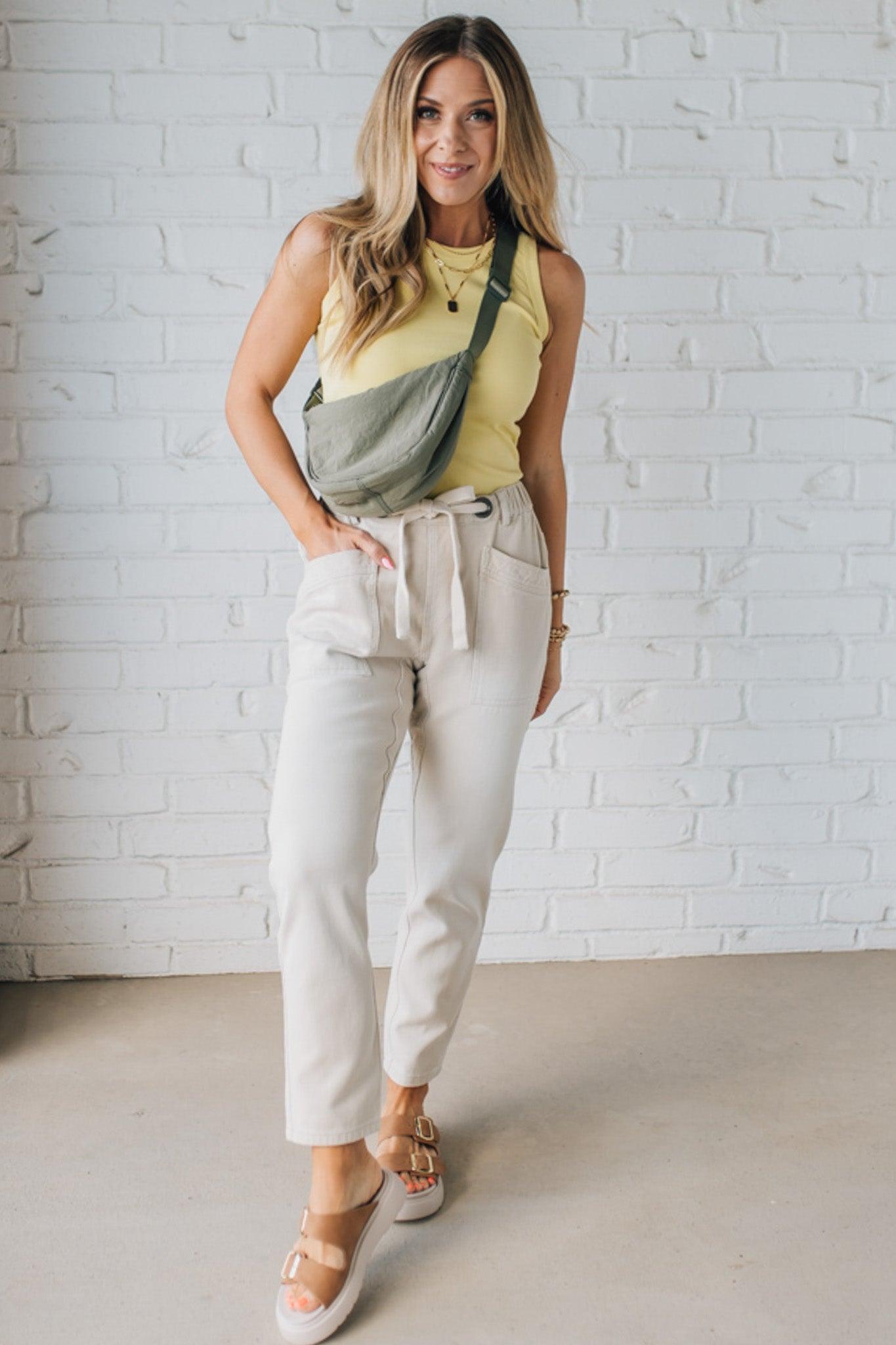 Blonde Woman Wearing a Solid Basic Cotton Garment Dyed Round Neck Tank Top.