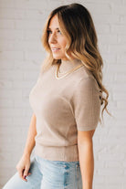 Blonde girl modeling a half sleeve mini ribbed fitted top with mock neck