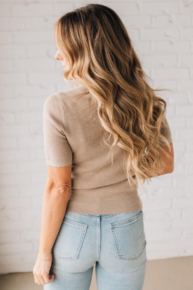 Blonde girl modeling a half sleeve mini ribbed fitted top with mock neck