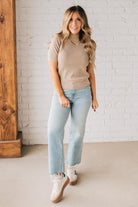Blonde girl modeling a half sleeve mini ribbed fitted top with mock neck