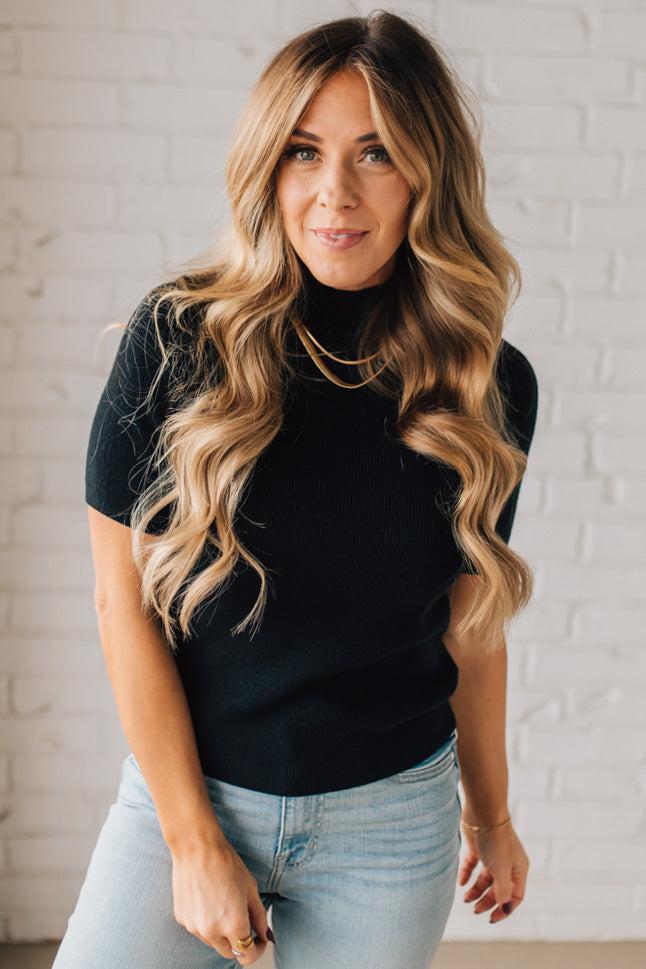 Blonde girl modeling a half sleeve mini ribbed fitted top with mock neck