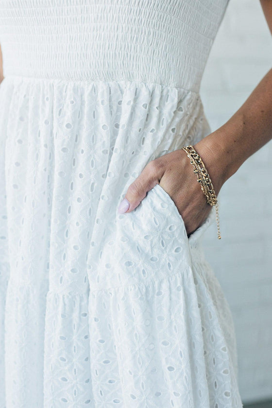 close up shot of the pocket on a white eyelet detail maxi dress