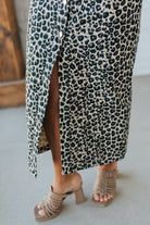 Blonde Woman Wearing a Button Front Maxi Leopard Denim Shirt Dress.