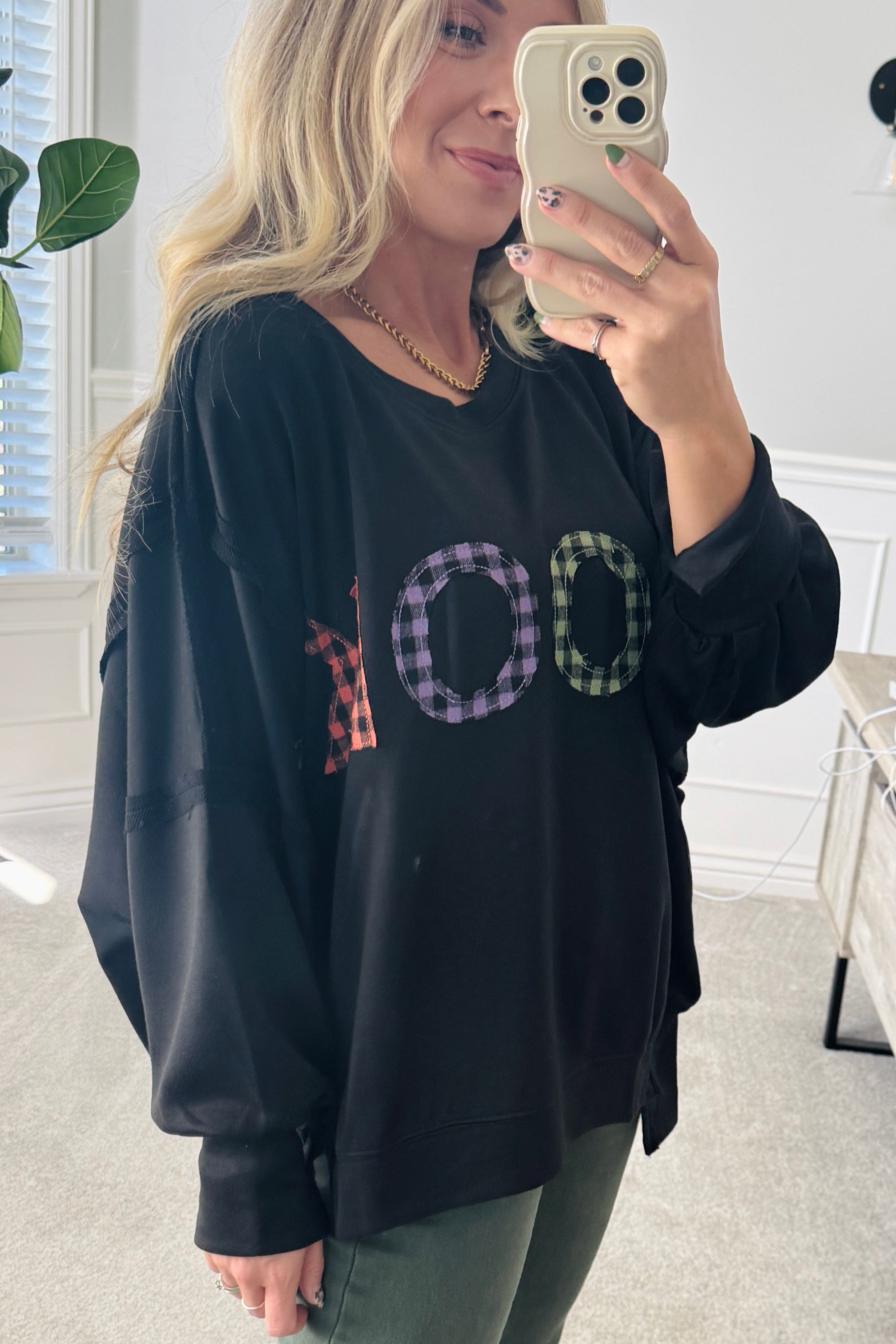 Blonde Woman Wearing a Halloween Theme Spooky Letter Top