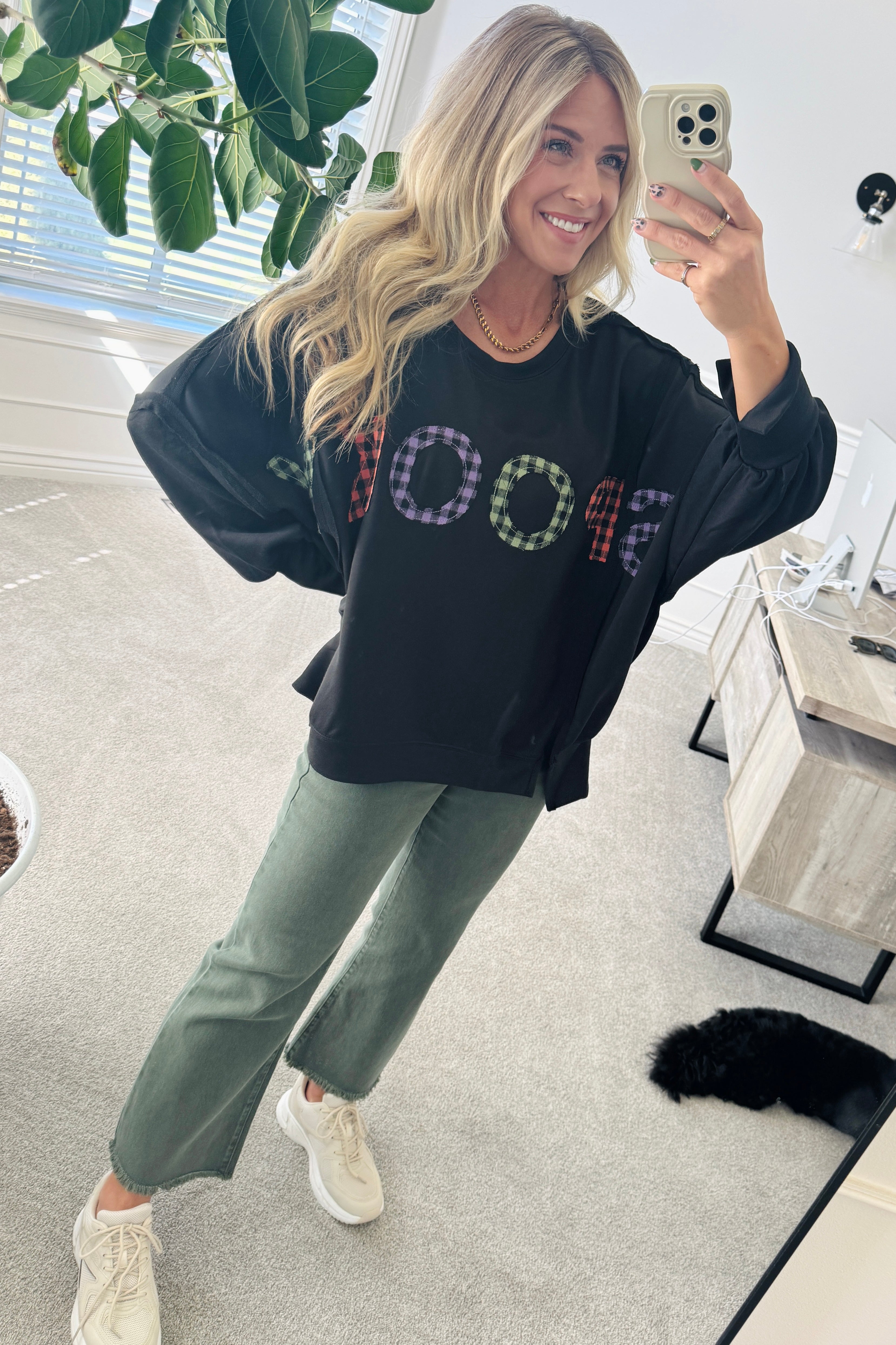 Blonde Woman Wearing a Halloween Theme Spooky Letter Top