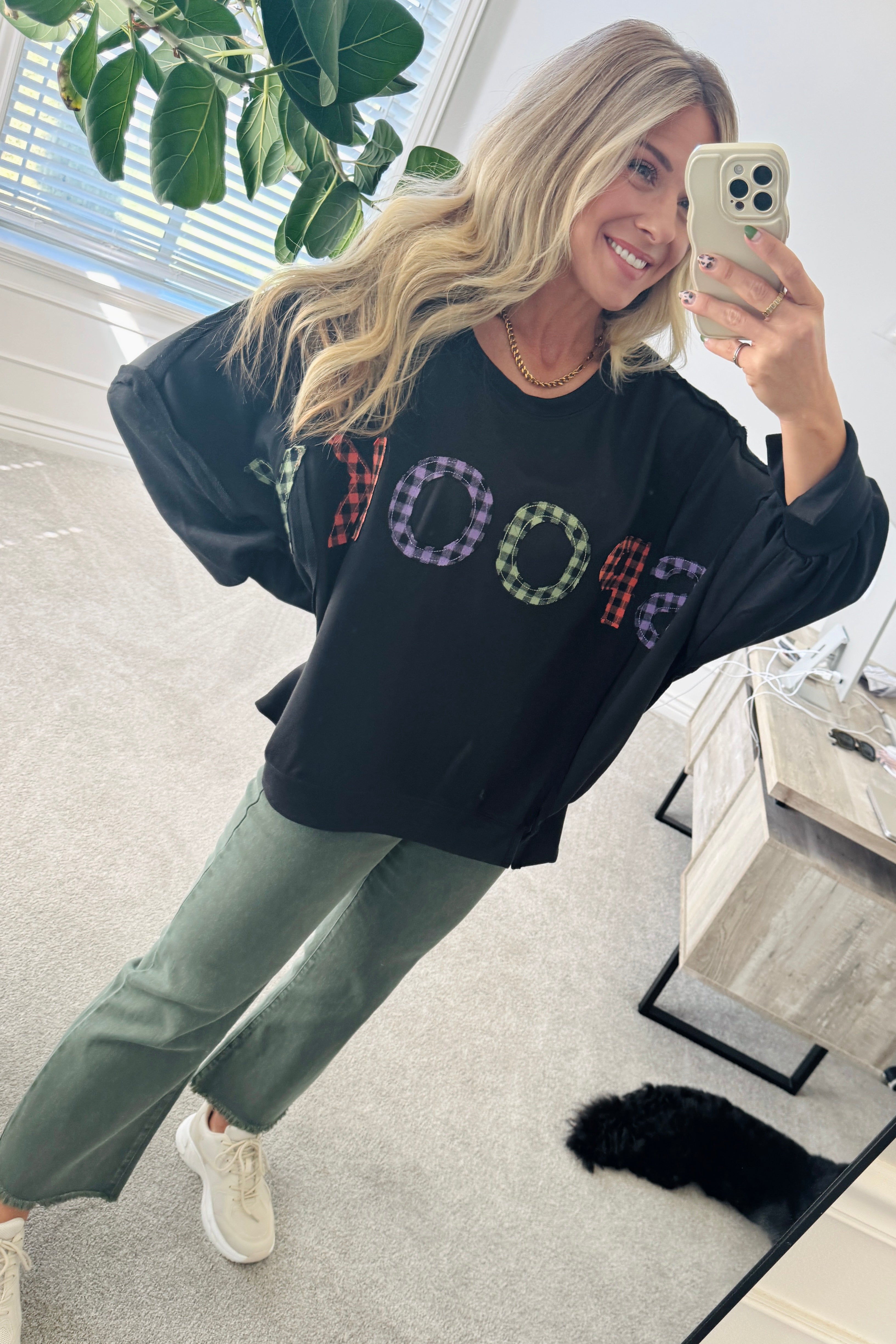 Blonde Woman Wearing a Halloween Theme Spooky Letter Top