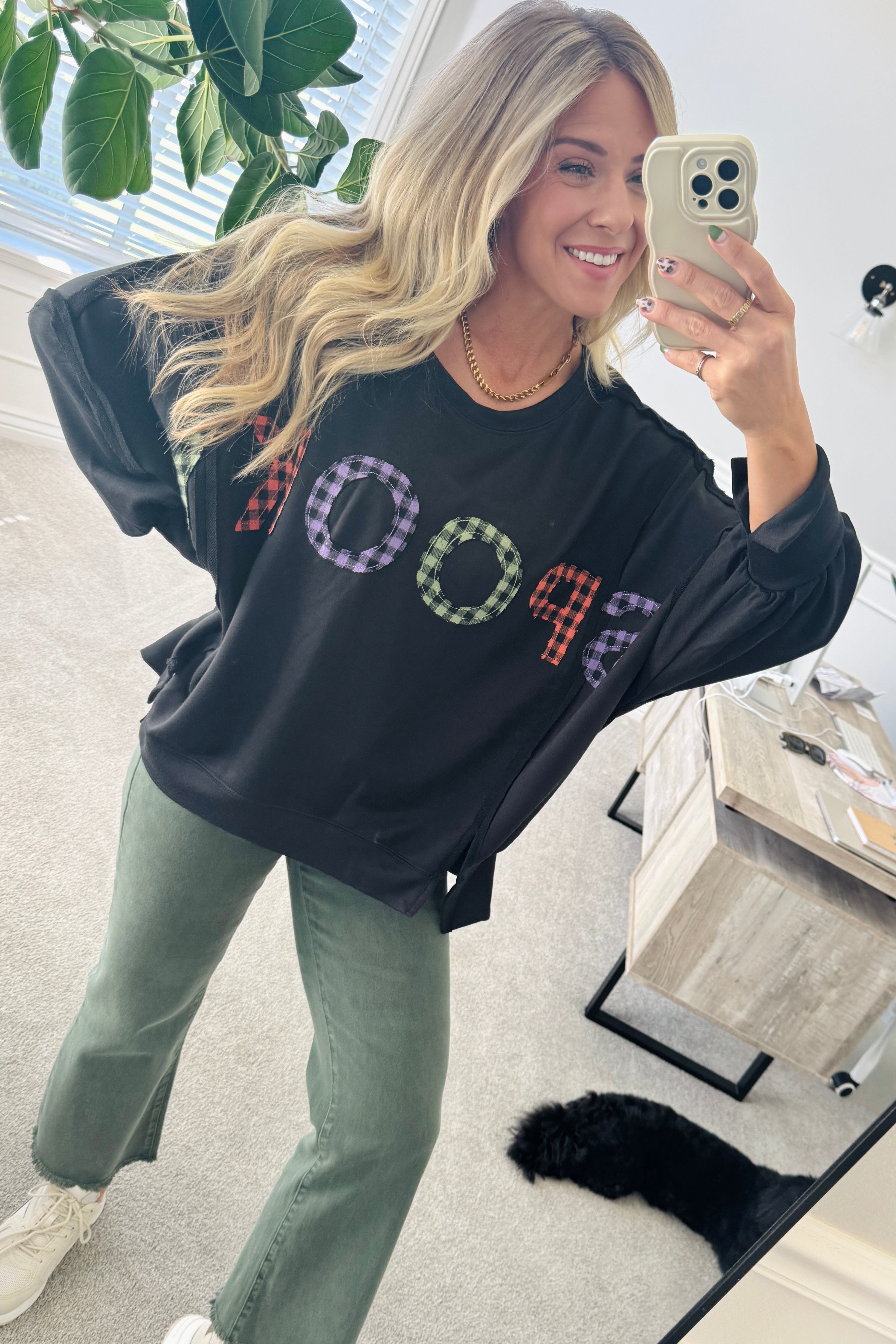 Blonde Woman Wearing a Halloween Theme Spooky Letter Top