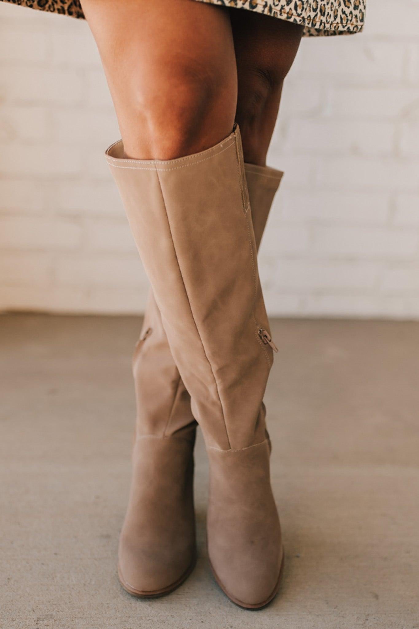 A beautiful tall soft faux suede boot on a stacked heel makes it a versatile staple in any wardrobe.
