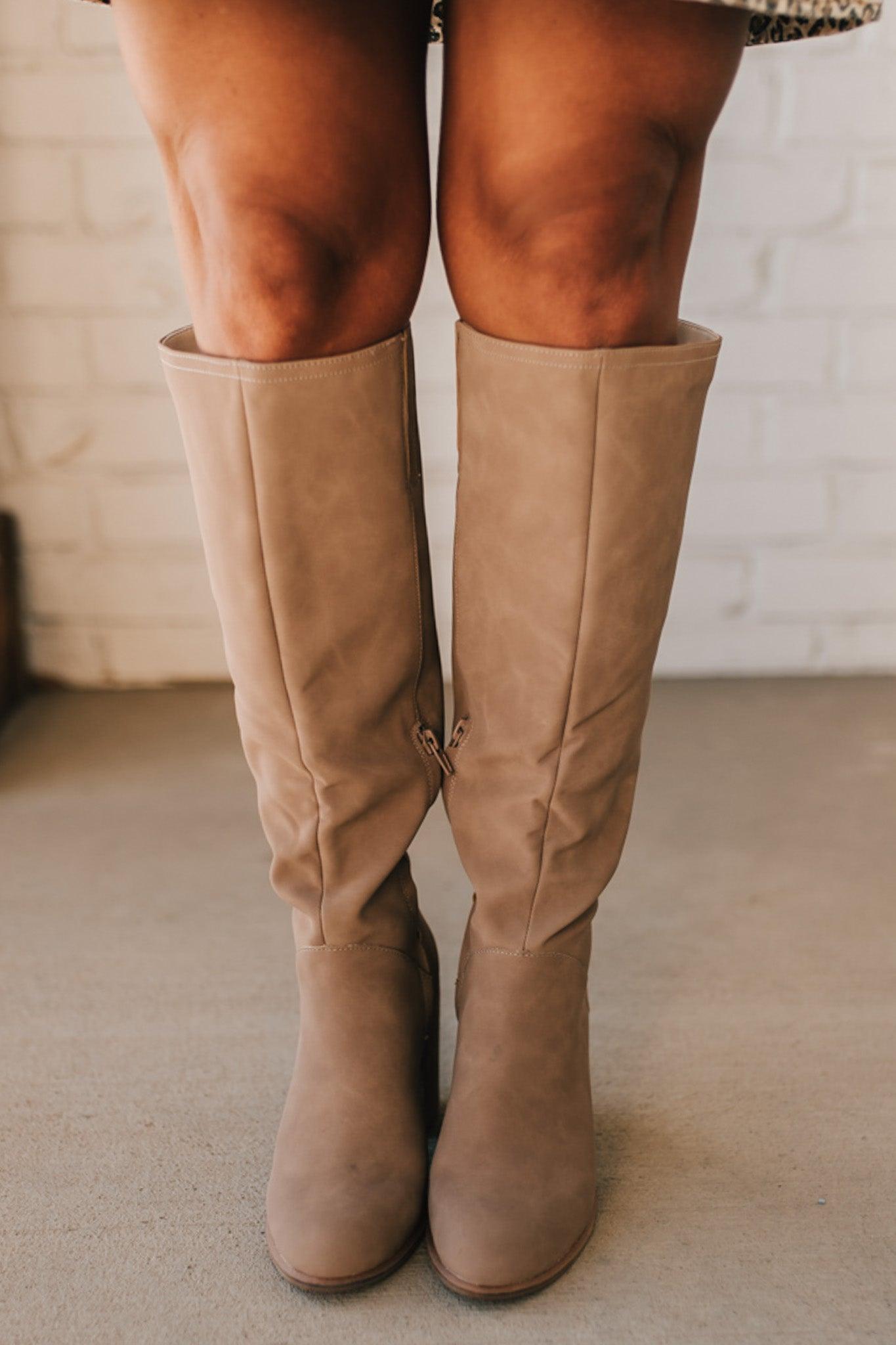 A beautiful tall soft faux suede boot on a stacked heel makes it a versatile staple in any wardrobe.