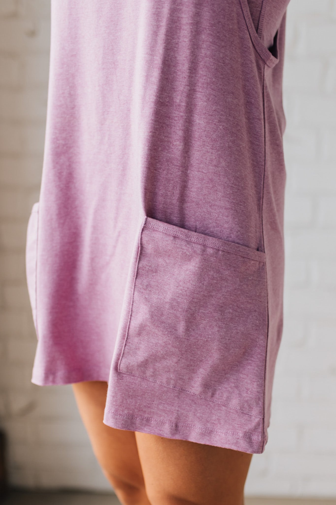 Blonde woman wearing a Mini Dress With Built-in Romper Liner.