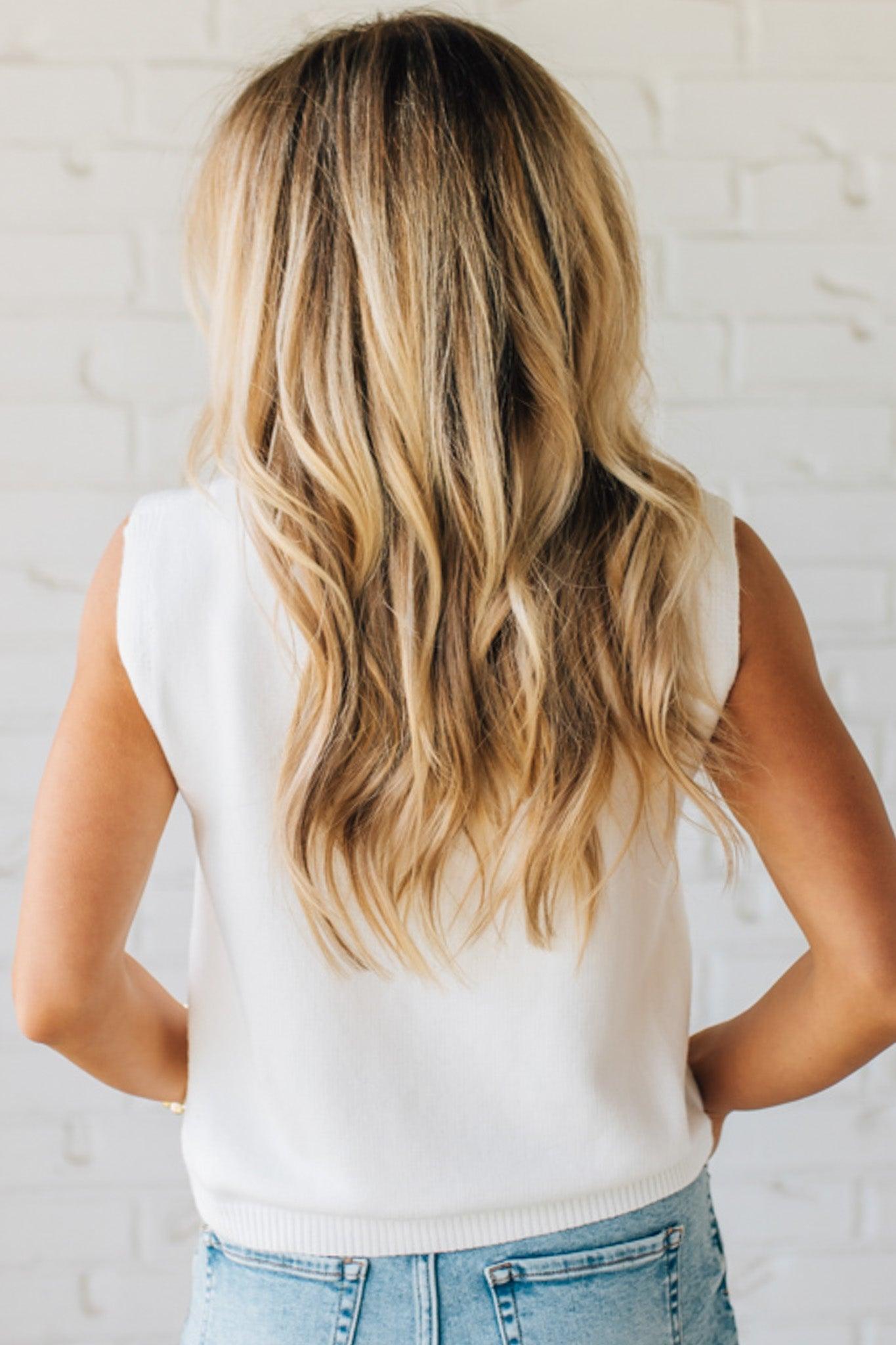 BLONDE WOMAN IN DENIM SHORTS WEARING A TEDDY BEAR WEARING AN AMERICAN FLAG WITH USA EMBROIDERY LETTERING FOURTH OF JULY SWEATER TANK TOP.