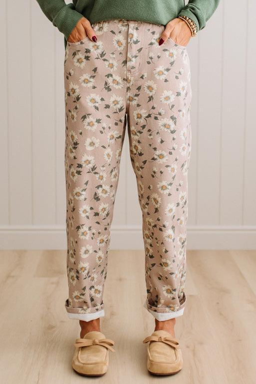 Woman Standing on Light Wood Floor with a Paneled Wall behind and wearing a green shirt, light tan slip on loafers and Delicate Wildflower Harmony Classic Fit Trouser Pants.