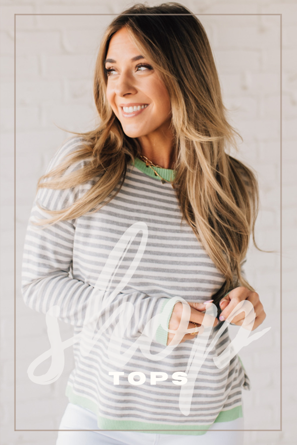 shop our tops collection! Blonde model is wearing a heather grey and ivory striped long sleeve, lightweight sweater with a light green contrasting trim on the neckline, hem and sleeve cuff