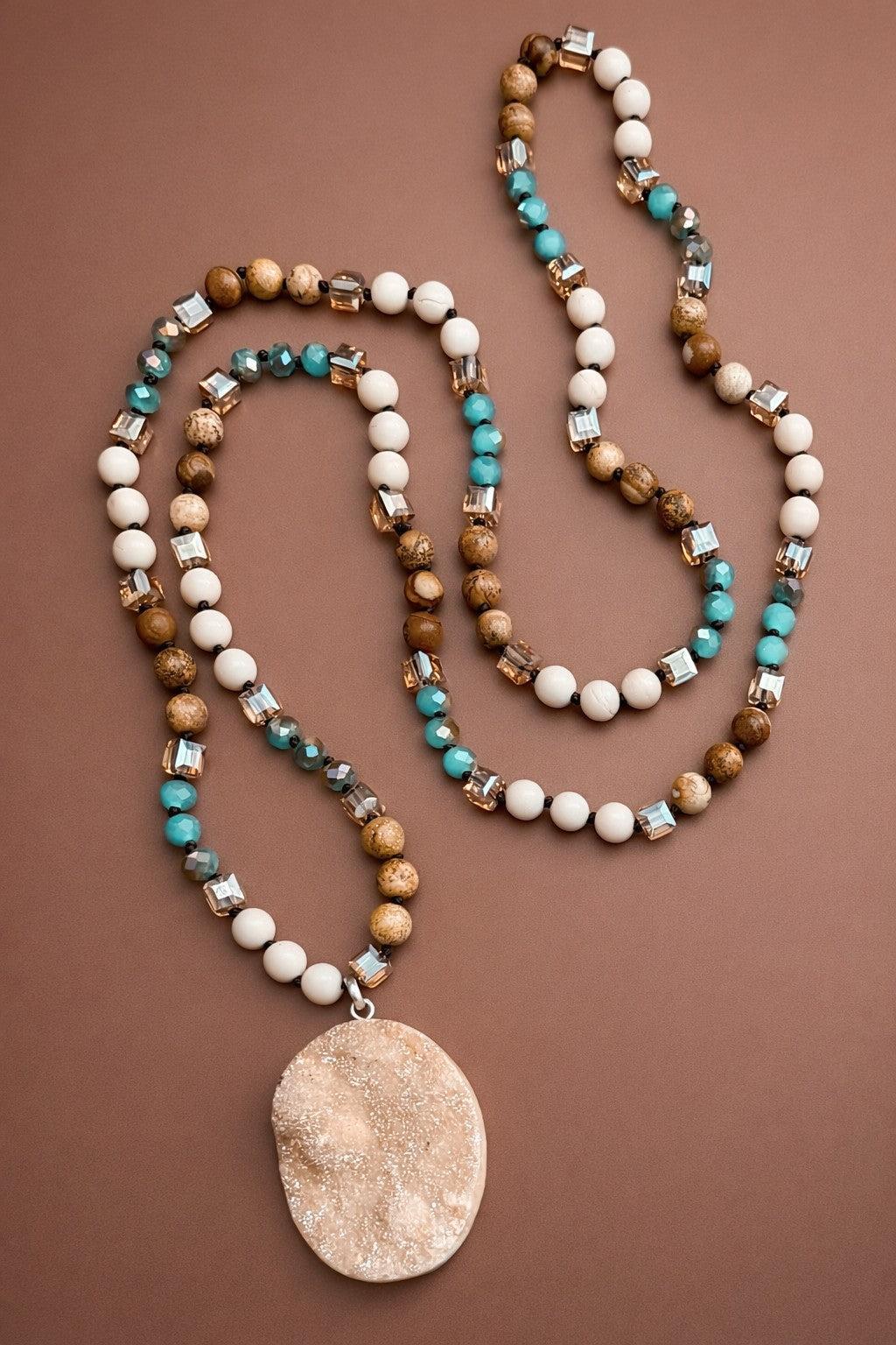 Beaded necklace with a pendant on a brown background