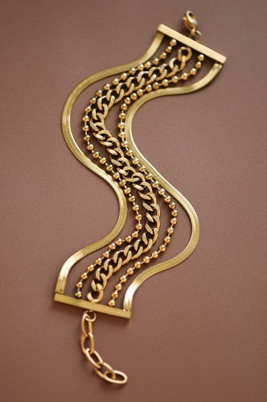 Gold bracelet with chain design on a brown background