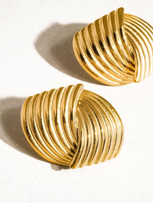 gold stud earings with an alternating swirl pattern