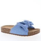 Blue sandal with a bow on a white background