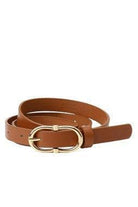 Camel belt with gold buckle on a white background